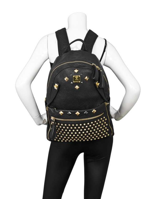 Mcm backpack discount black and gold