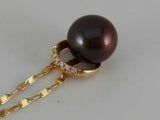 "Comete" women's necklace in 18 kt rosé gold with natural diamonds 0.04 ct tot.and dark pearl on the pendant. Weight: 5.5 g